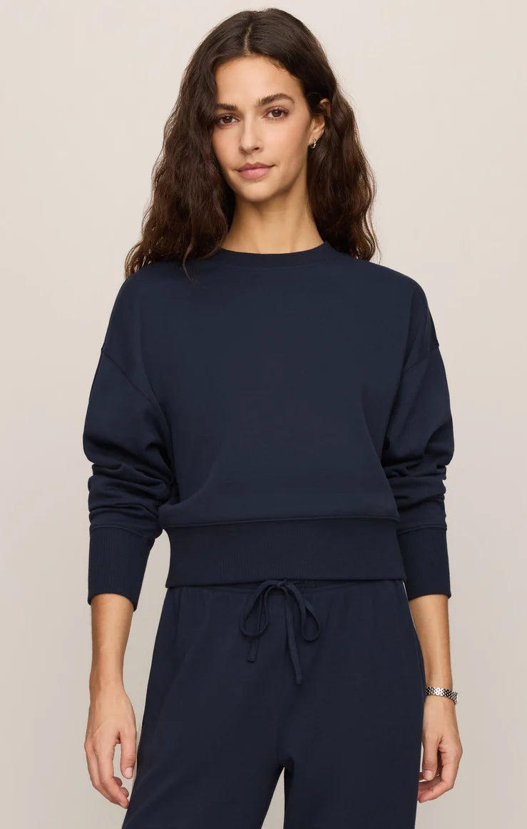 Relaxed crewneck sweatshirt with dropped shoulders, long sleeves, and ribbed trim.