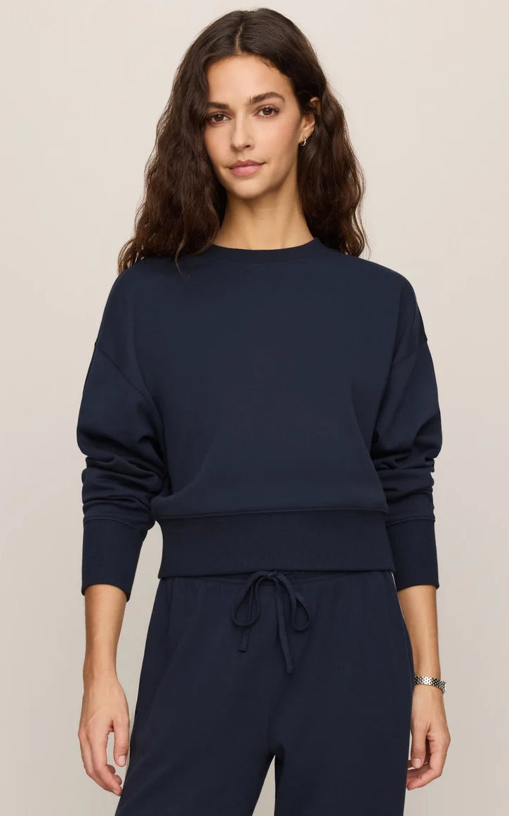 Relaxed crewneck sweatshirt with dropped shoulders, long sleeves, and ribbed trim.