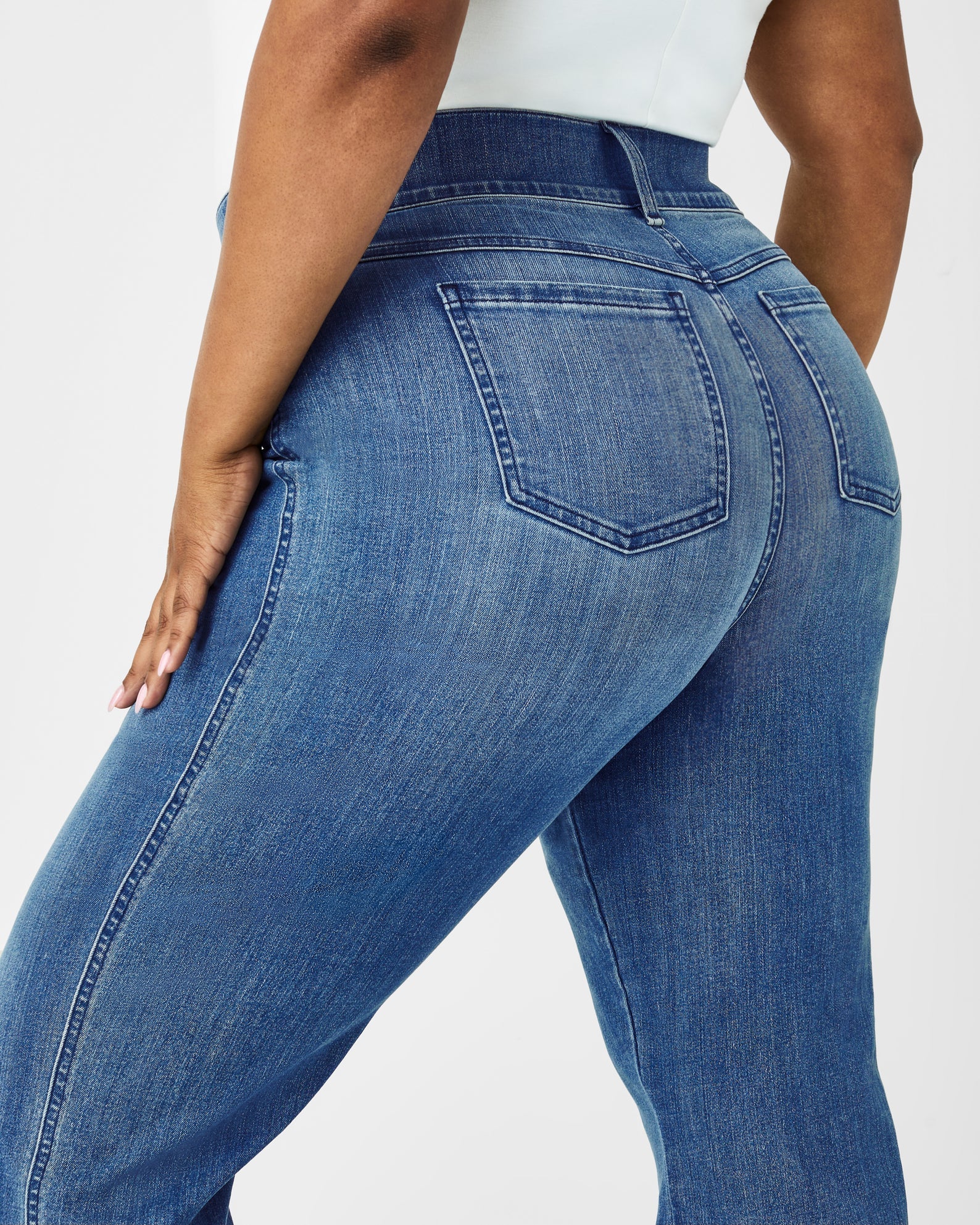 Spanx Kick Flare Jeans Blue. Designed with premium stretch denim, high-rise coverage and hidden core shaping technology, this pull-on jean features a flattering kick flare leg.