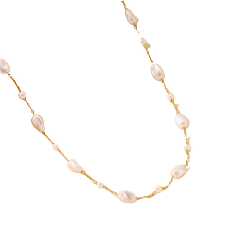 Gold-tone chain necklace featuring irregular pearl-inspired accents spaced throughout a delicate strand, creating an elegant and organic look.