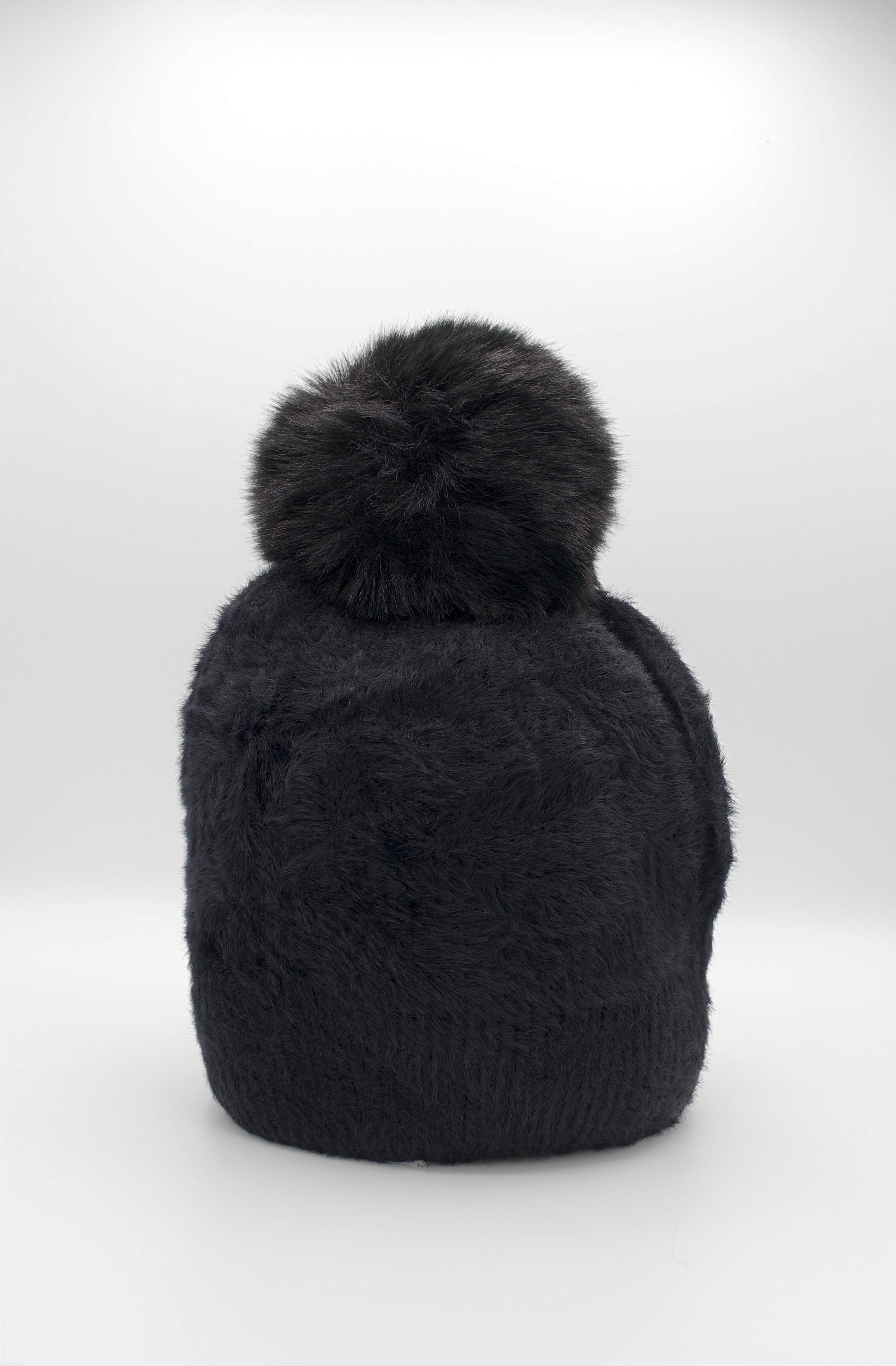 Classic Fuzzy Pom Beanie Black. This fuzzy beanie features a soft fuzzy fabric with a pom-pom on top, perfect for wearing everyday in the colder months.