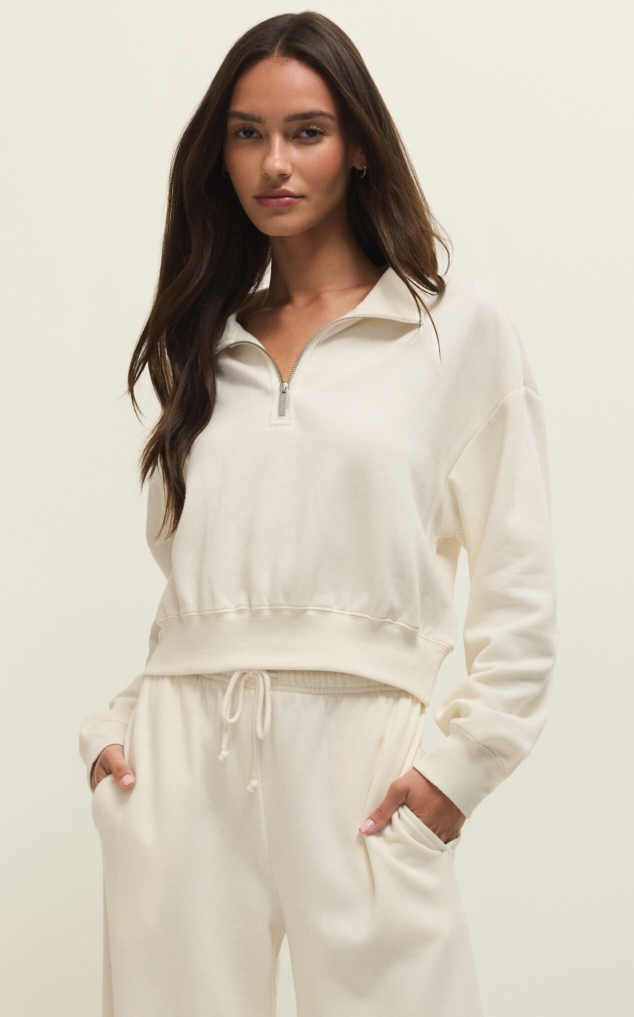 women's half zip pullover, relaxed lounge top, casual matching set top, everyday elevated basics, soft knit pullover, minimal lounge wear, modern athleisure top, effortless layering piece, relaxed fit sweatshirt, travel lounge outfit, cozy casual outfit, neutral wardrobe staple, boutique casual top