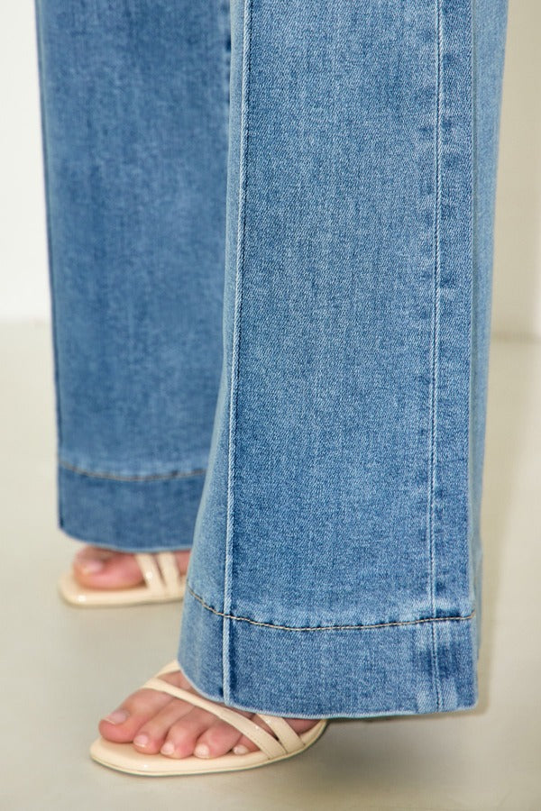 Hidden Happi Low Rise Pintuck Comfort Flare in Medium Light, detail of flared hem