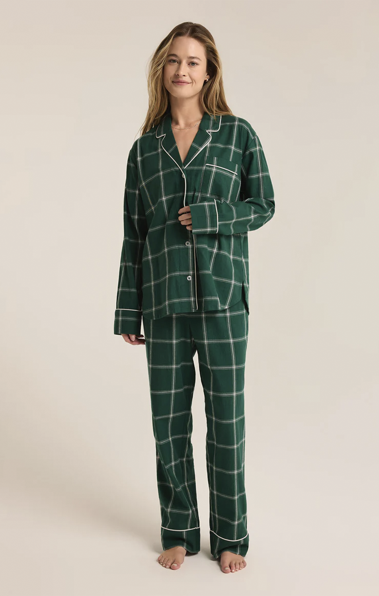 Snuggle up in this striped pajama set, crafted from soft-washed flannel for ultimate comfort. The top features a v-neck, collared button-front design with classic buttons, while the mid-rise, full-length pants offer an elastic waistband and side seam pockets. It’s the perfect cozy set to make your new go-to for relaxation.