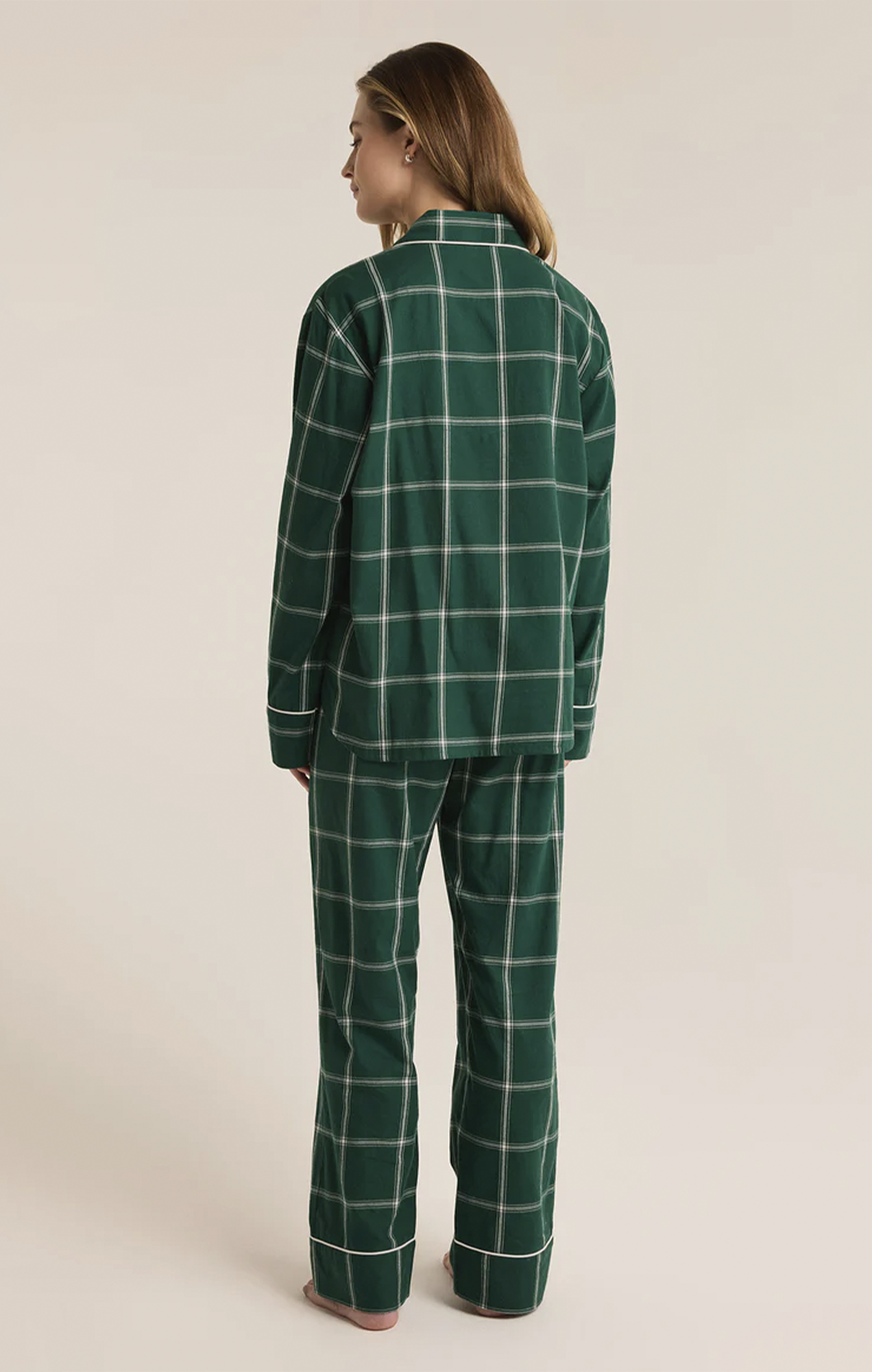 Snuggle up in this striped pajama set, crafted from soft-washed flannel for ultimate comfort. The top features a v-neck, collared button-front design with classic buttons, while the mid-rise, full-length pants offer an elastic waistband and side seam pockets. It’s the perfect cozy set to make your new go-to for relaxation.