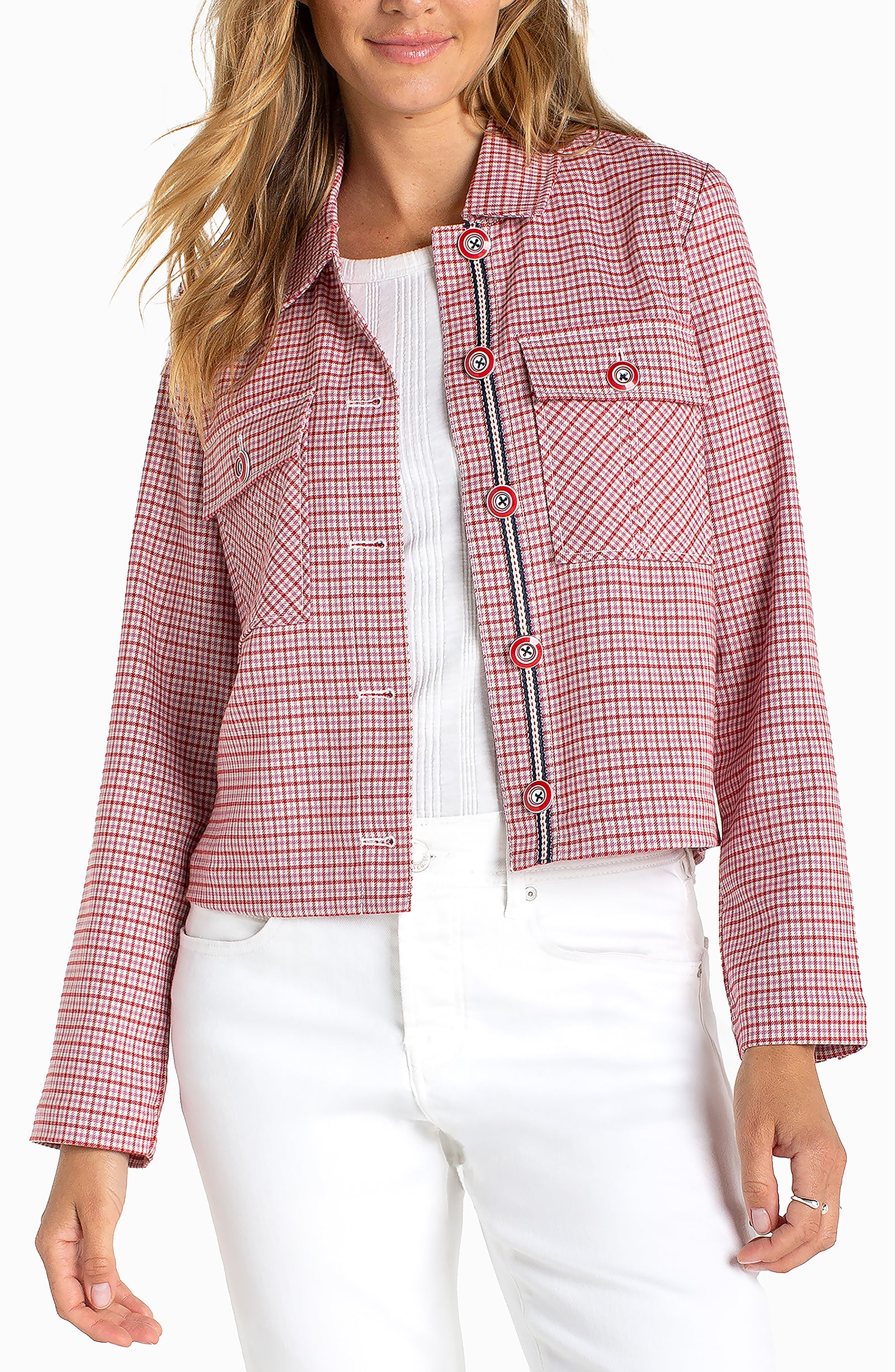 Women's cropped checkered jacket with statement buttons, flap pockets, contrast trim detailing, and long sleeves styled with white denim.