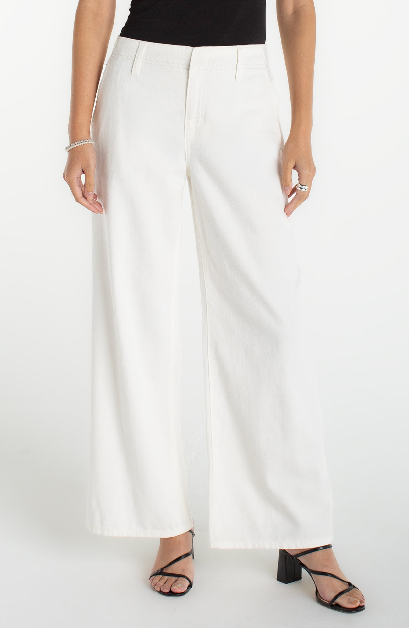 Women's high-rise wide-leg pants with a tailored fit, full-length silhouette, and clean finish styled with heeled sandals.