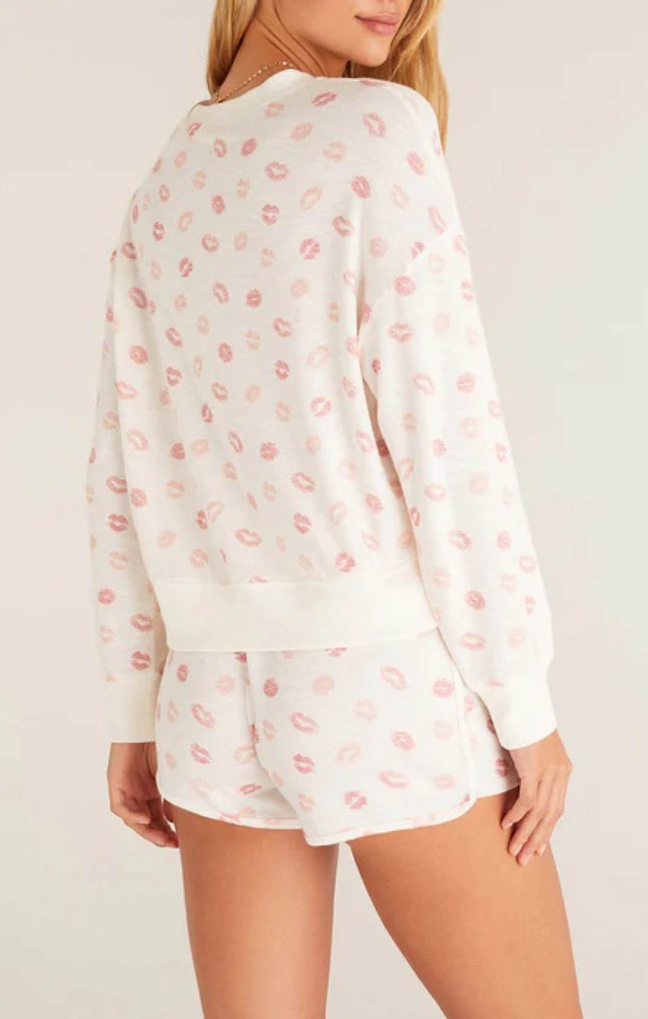 Z Supply Elle Lip Top This lips top is so soft and comfy, featuring an adorable all over kiss print with rib details it's perfect with a pair of matching shorts or joggers!