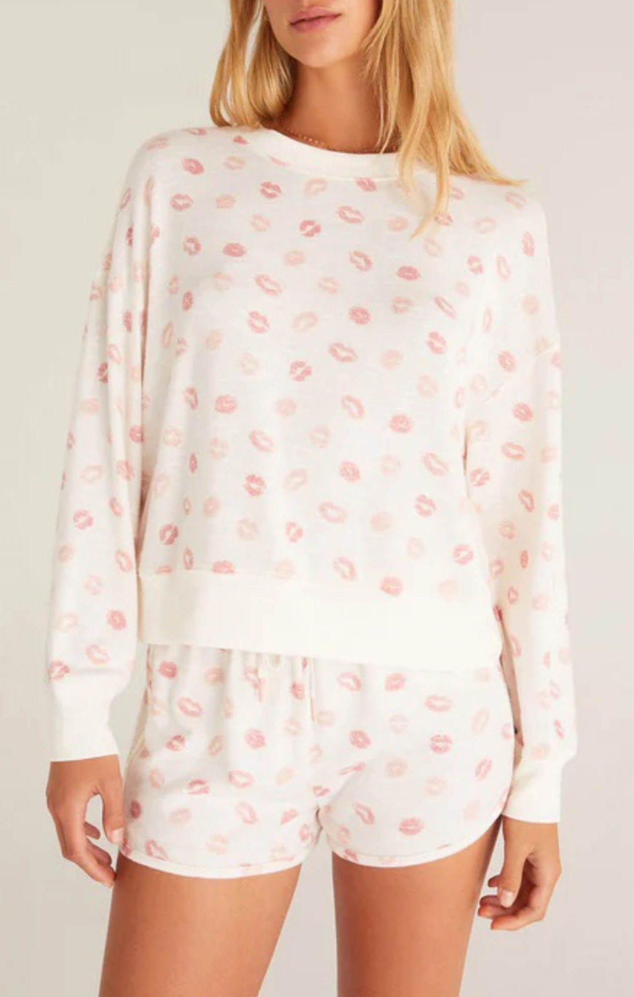 Z Supply Elle Lip Top This lips top is so soft and comfy, featuring an adorable all over kiss print with rib details it's perfect with a pair of matching shorts or joggers!
