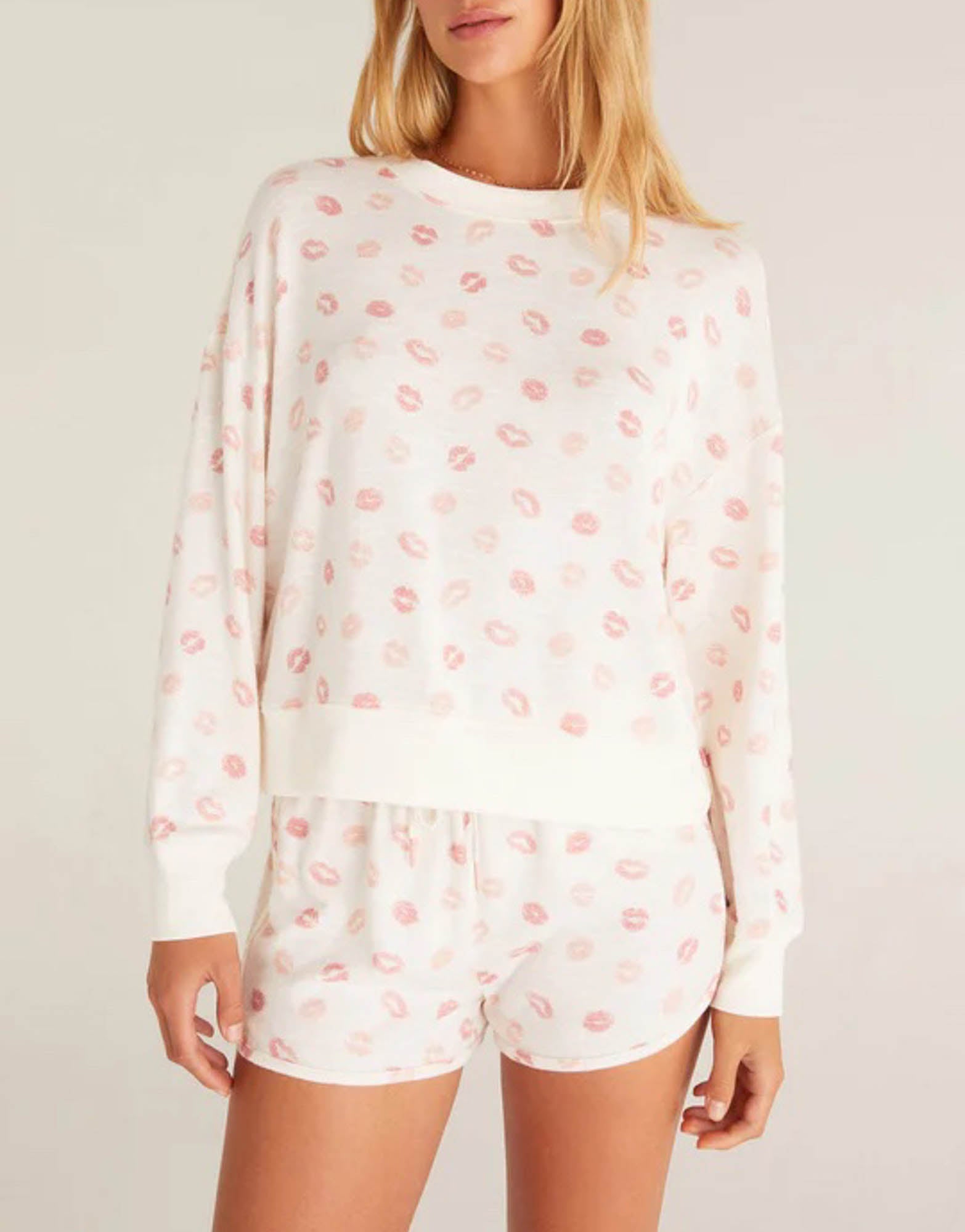 Z Supply Elle Lip Top This lips top is so soft and comfy, featuring an adorable all over kiss print with rib details it's perfect with a pair of matching shorts or joggers!