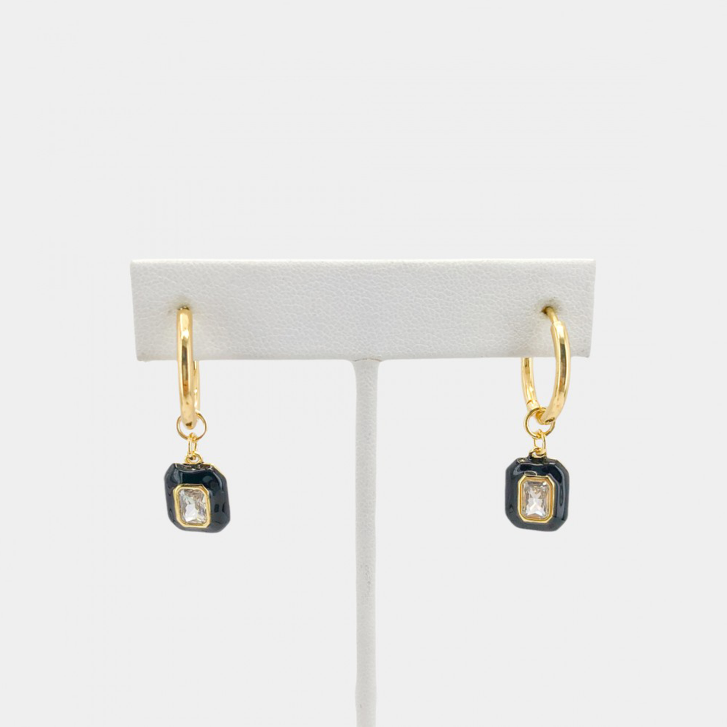 Round hoop earrings with dangling enamel cubic zirconia gem. The gem is removable, you may wear it alone as huggies or add one of our other charms or pendants to change up the look