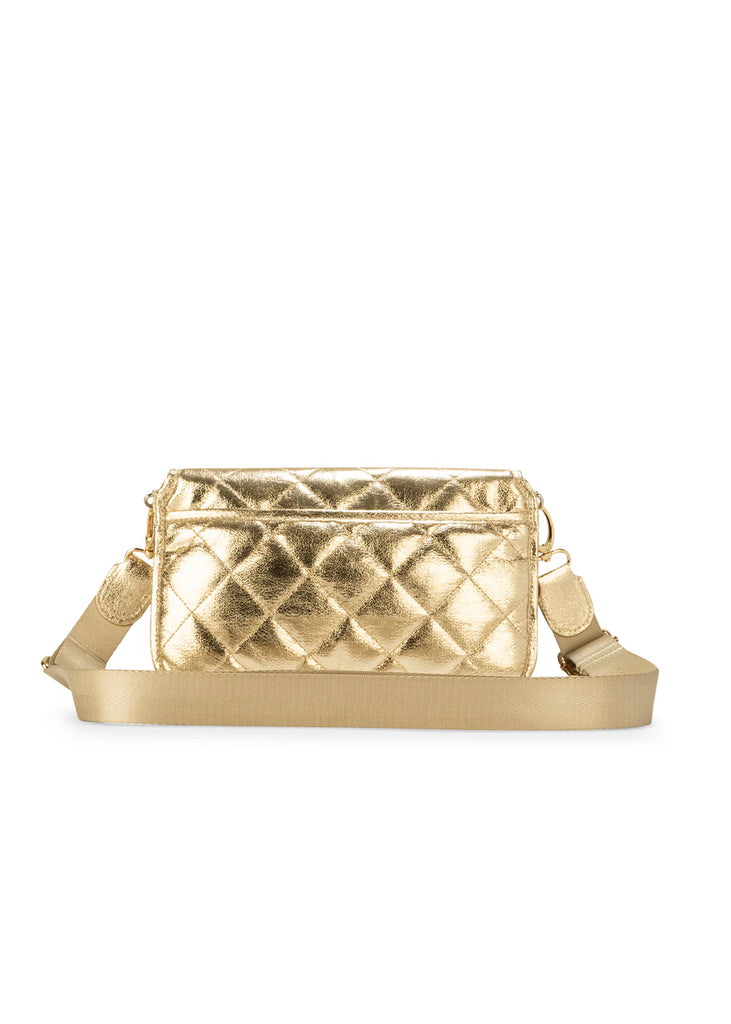 Haute Shore Rae Crossbody Gilt. This crossbody features a quilted design with a flap closure, the perfect size for everyday wear that can be used day or night as a crossbody or a clutch.