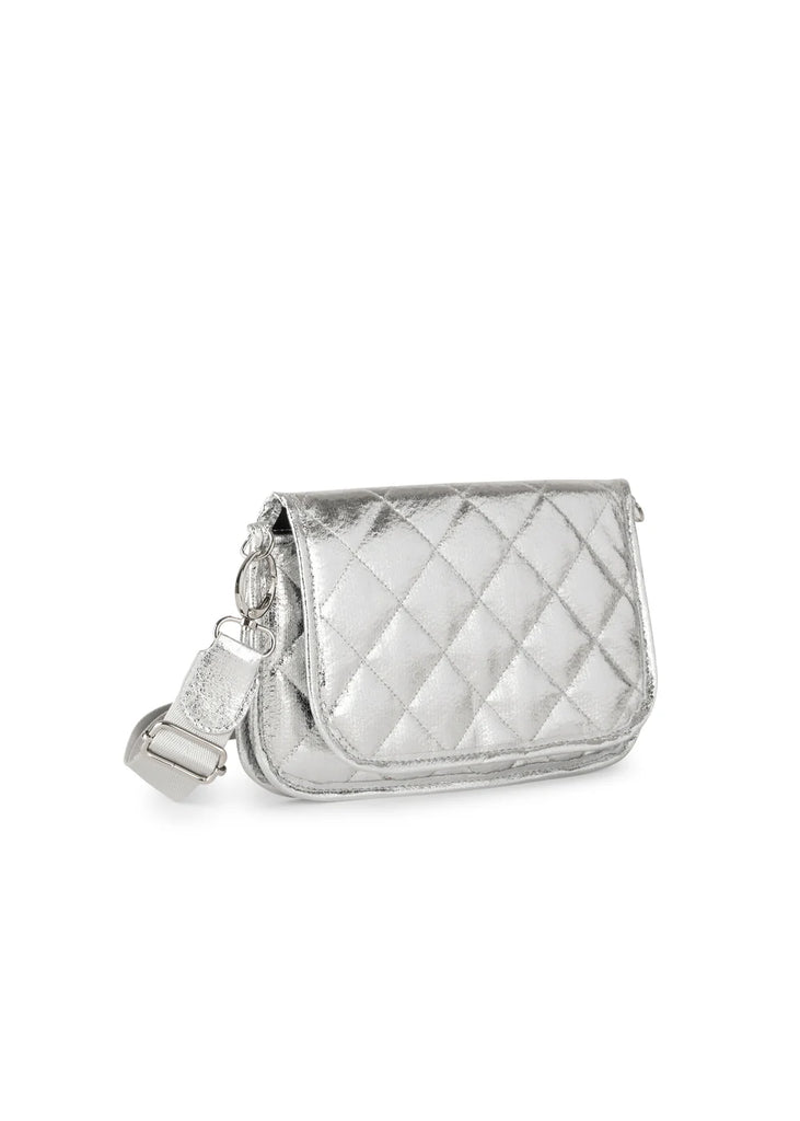 Haute Shore Rae Crossbody Silver. This crossbody features a quilted design with a flap closure, the perfect size for everyday wear that can be used day or night as a crossbody or a clutch.