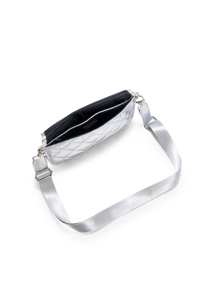 Haute Shore Rae Crossbody Silver. This crossbody features a quilted design with a flap closure, the perfect size for everyday wear that can be used day or night as a crossbody or a clutch.