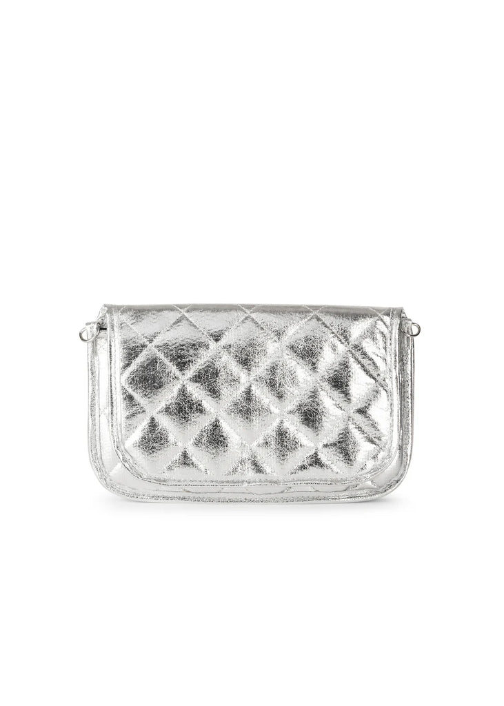 Haute Shore Rae Crossbody Silver. This crossbody features a quilted design with a flap closure, the perfect size for everyday wear that can be used day or night as a crossbody or a clutch.