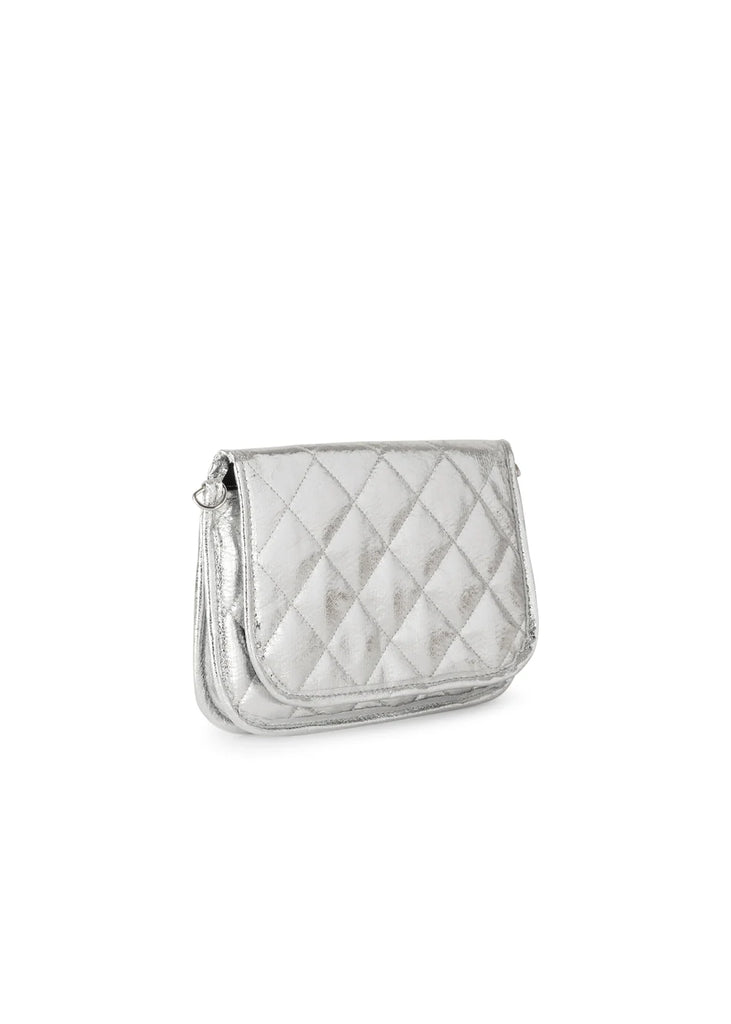 Haute Shore Rae Crossbody Silver. This crossbody features a quilted design with a flap closure, the perfect size for everyday wear that can be used day or night as a crossbody or a clutch.