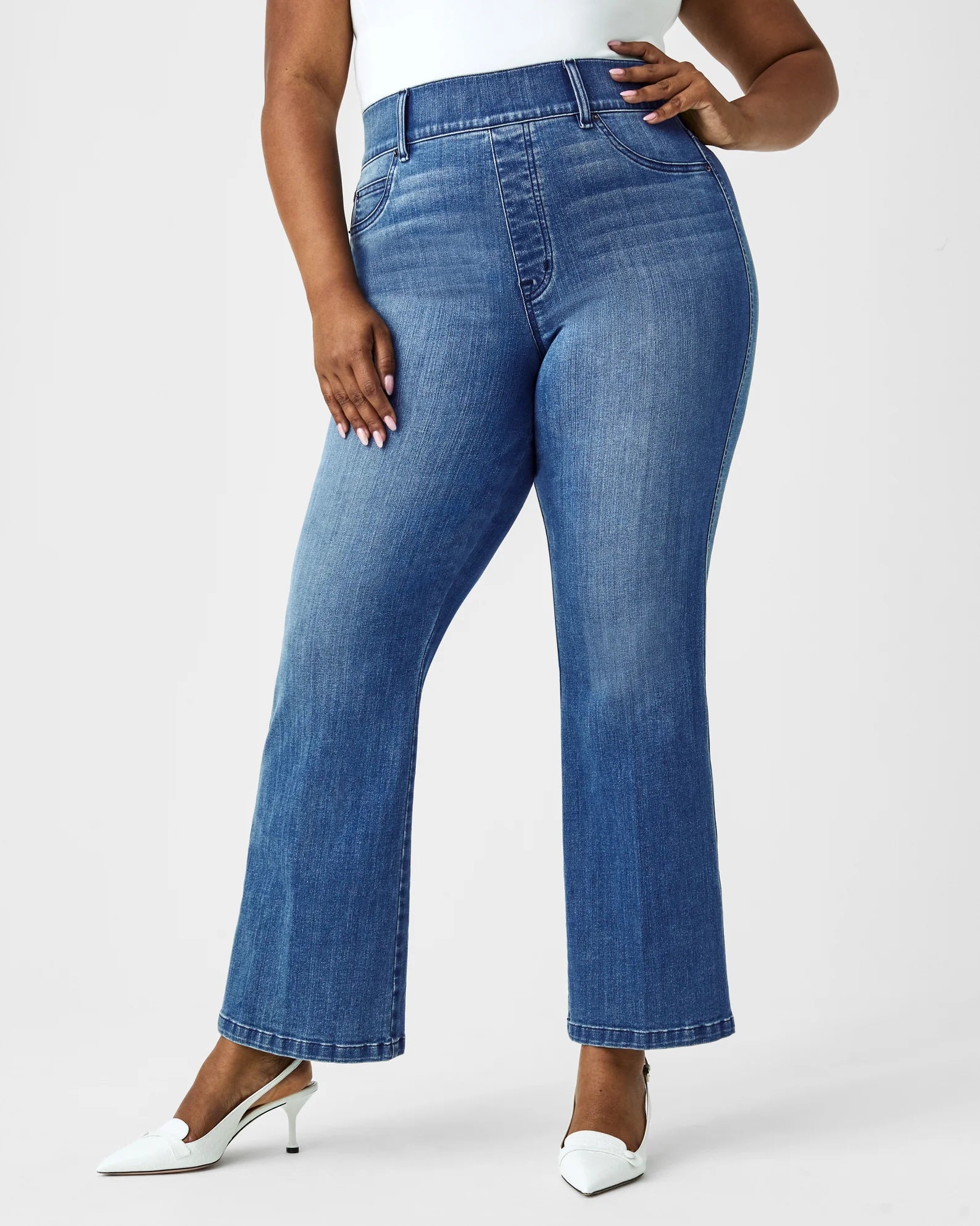 Spanx Kick Flare Jeans Blue. Designed with premium stretch denim, high-rise coverage and hidden core shaping technology, this pull-on jean features a flattering kick flare leg.