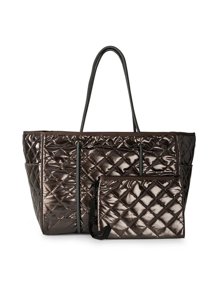 Haute Shore Greyson Smoke. This metallic quilted tote holds everything you need for when you're on the go day or night, with a lightweight adjustable design perfect for everyday.