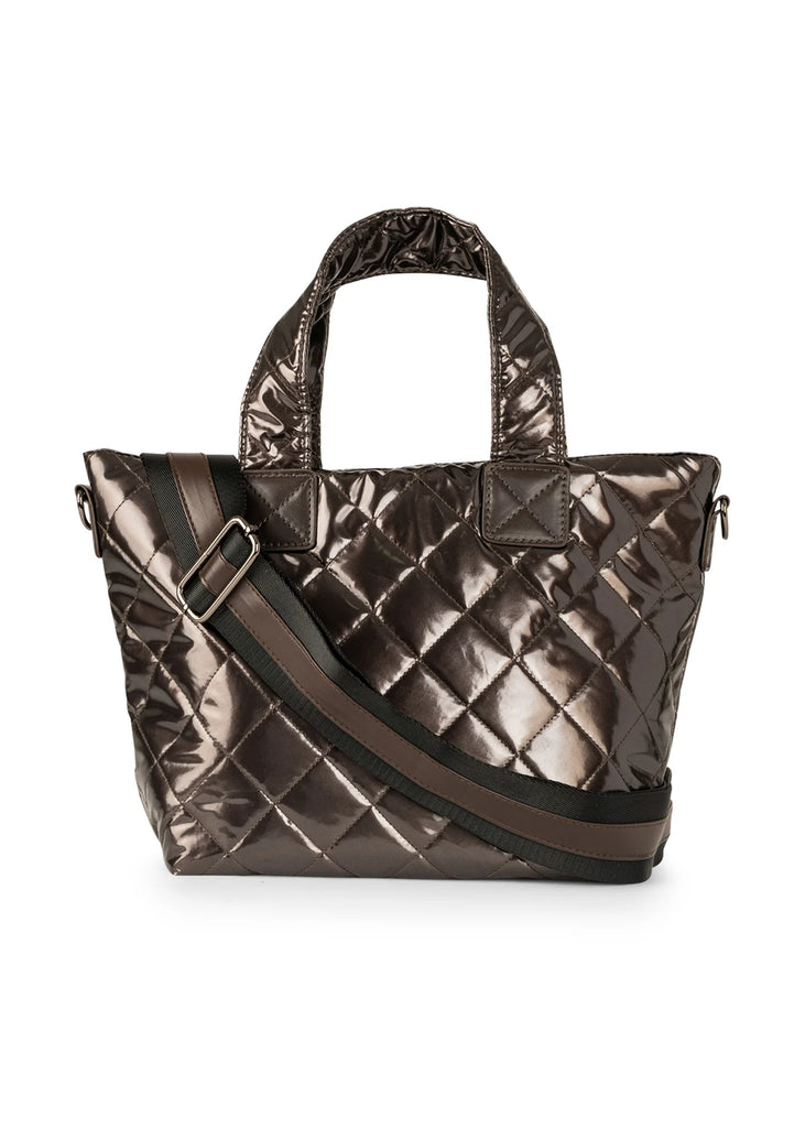 Haute Shore Ryan Mini Tote Smoke. This puffer compact zip top tote goes from day to night with its streamline design and quilted metallic finish perfect for fall and winter.