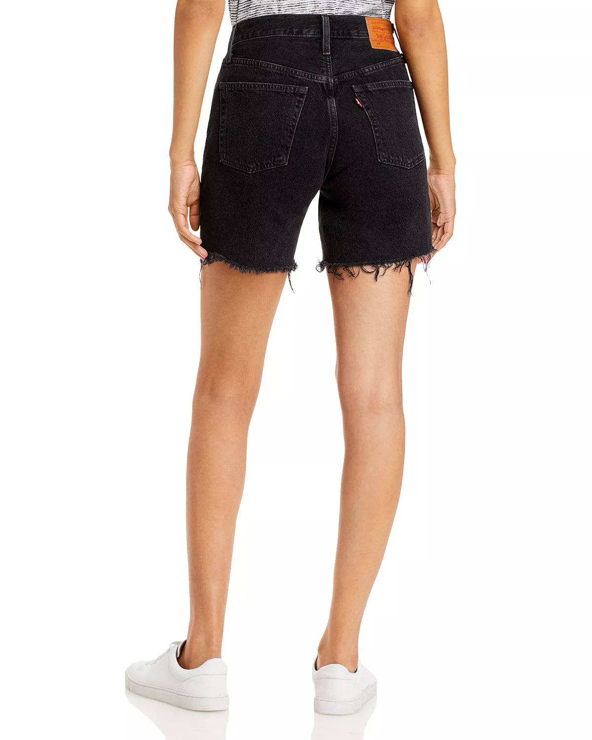 Levi 501 Black Mid Thigh Short Lunar Black. Wear your favorite 501s through the warmer months with classic, straight-fit mid length shorts crafted from dark denim with authentic distressing at the hems.
