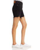 Levi 501 Black Mid Thigh Short Lunar Black. Wear your favorite 501s through the warmer months with classic, straight-fit mid length shorts crafted from dark denim with authentic distressing at the hems.