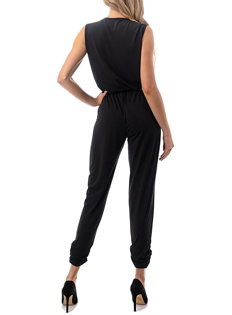 Vera Sleeveless Crossover Jumpsuit Black. This crossover jumpsuit is a must have closet staple, throw it on with heels for a more dressed up look or with sneakers and a denim jacket for a casual everyday outfit.