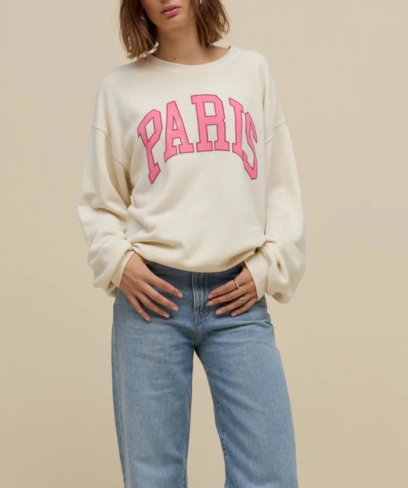 Day Dreamer Paris Crewneck Stone Vintage. Just like your college crew, but better, stamped with ‘Paris’ in collegiate style letters on our oversized, ultra cozy fleece, perfect for on the go or hanging at home.