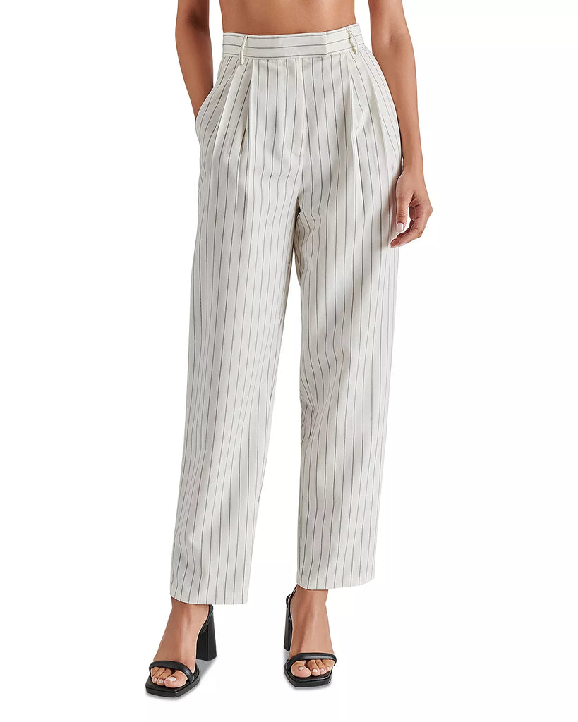 Steve Madden Rumi Pant Cream. Elevate your spring wardrobe with the Rumi Pant. These pinstripe suiting trousers are menswear inspired and feature a tapered design and pleated detailing. These trousers offer a sophisticated and polished look for any occasion.