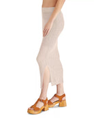 Steve Madden Liliana Skirt Oat Milk. Discover the perfect combination of style and comfort with the Liliana Skirt. This wavy crochet midi skirt features a side slit for added flair and is lined with a mini slip for a comfortable fit.
