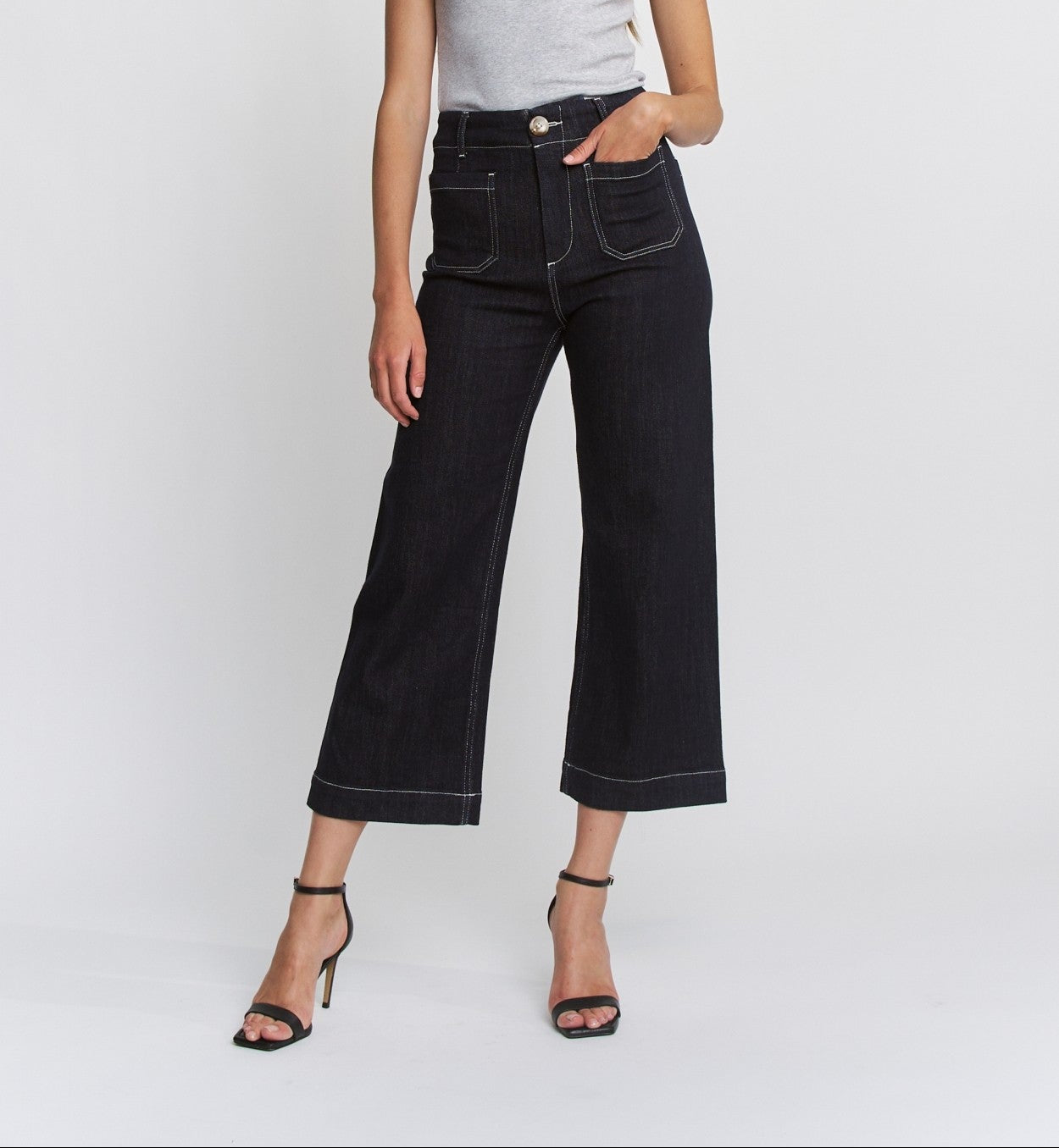 High-rise wide-leg jeans with contrast stitching, front patch pockets, and a cropped hem.