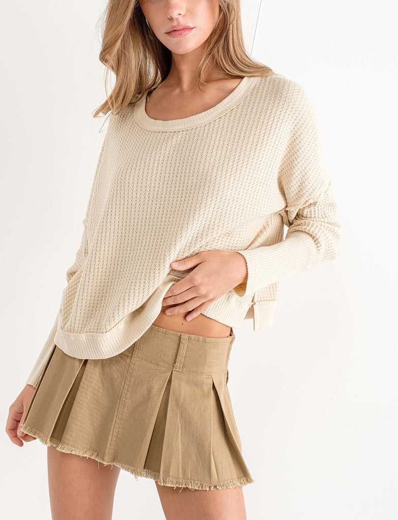 Sadie Waffle Knit Thermal Burnt Natural. This waffle knit thermal features dropped dolman sleeves and a wide scoop neckline, perfect for wearing everyday this fall and winter.