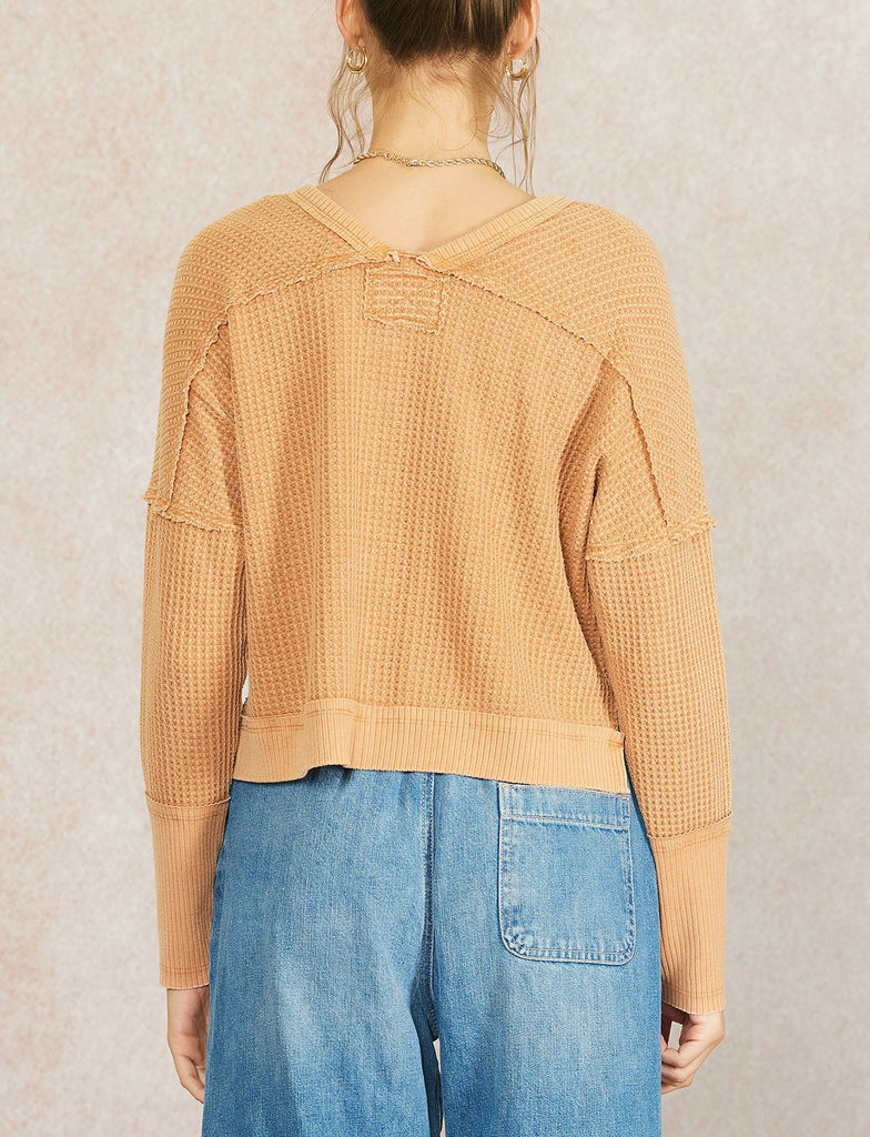 Sadie Waffle Knit Thermal Burnt Orange. This waffle knit thermal features dropped dolman sleeves and a wide scoop neckline, perfect for wearing everyday this fall and winter.