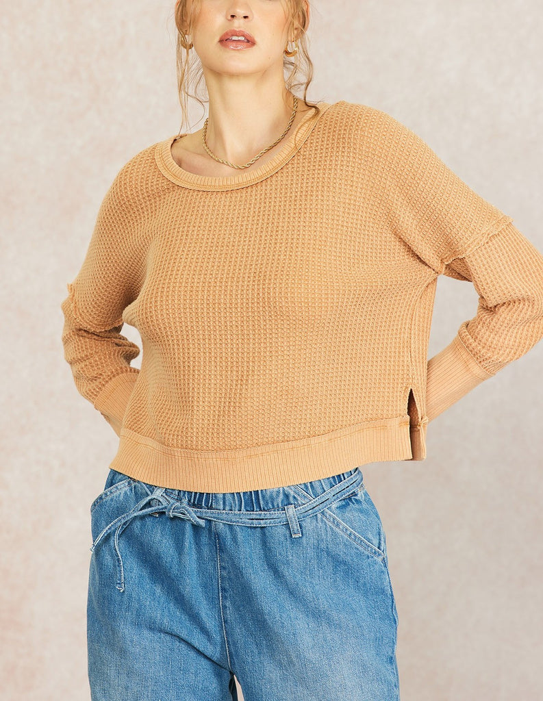 Sadie Waffle Knit Thermal Burnt Orange. This waffle knit thermal features dropped dolman sleeves and a wide scoop neckline, perfect for wearing everyday this fall and winter.
