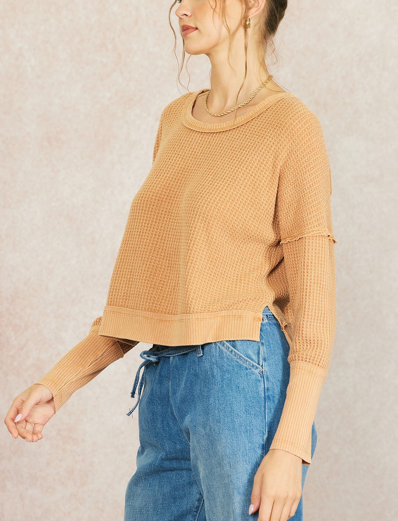 Sadie Waffle Knit Thermal Burnt Orange. This waffle knit thermal features dropped dolman sleeves and a wide scoop neckline, perfect for wearing everyday this fall and winter.