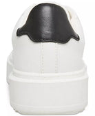 Steve Madden Charlie Sneaker White. A contrast accent at the counter interrupts the clean monochrome look of a street-chic sneaker elevated by a platform sole, perfect for everyday wear.