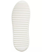 Steve Madden Charlie Sneaker White. A contrast accent at the counter interrupts the clean monochrome look of a street-chic sneaker elevated by a platform sole, perfect for everyday wear.