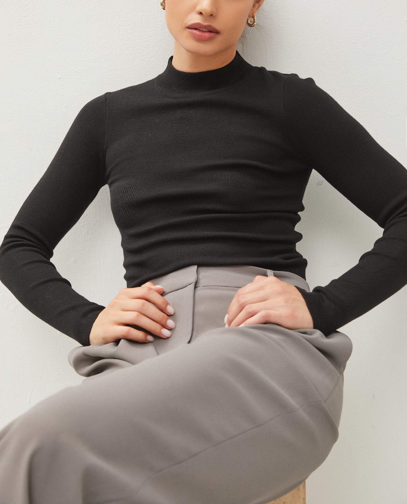 Moonbeam Long Sleeve Sweater Black. This ribbed long sleeve sweater features a mock neckline and fitted design making it the perfect layering piece for everyday.