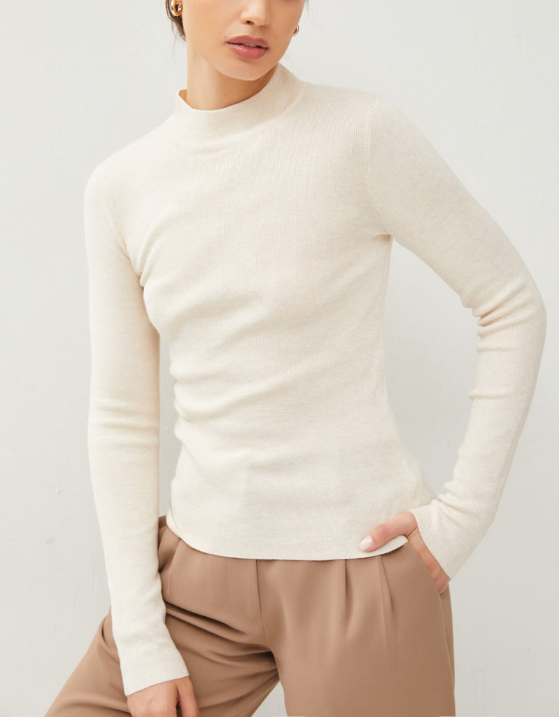 Moonbeam Long Sleeve Sweater Oatmeal. This ribbed long sleeve sweater features a mock neckline and fitted design making it the perfect layering piece for everyday.