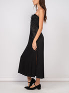 Ava Corset Satin Maxi Dress Black. This strapless satin maxi dress features a corset style bust and a zip back closure, perfect for looking chic at any special occasion.