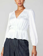 Current Air Peplum Surplus Blouse White. This long sleeve v-neck surplus blouse features a cinched waist with ruffle detail on the shoulder, the perfect everyday top to wear day or night.