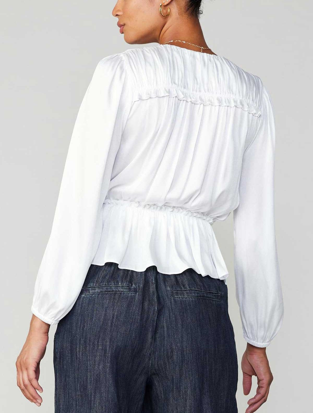 Current Air Peplum Surplus Blouse White. This long sleeve v-neck surplus blouse features a cinched waist with ruffle detail on the shoulder, the perfect everyday top to wear day or night.