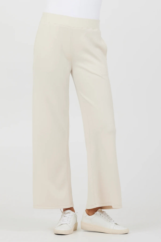 Vintage Havana Cloud Fleece Flare Pant Sand. These flare pant joggers come in the softest cloud fleece fabric and feature an elastic waistband with front pockets, perfect for hanging at home or on the go.