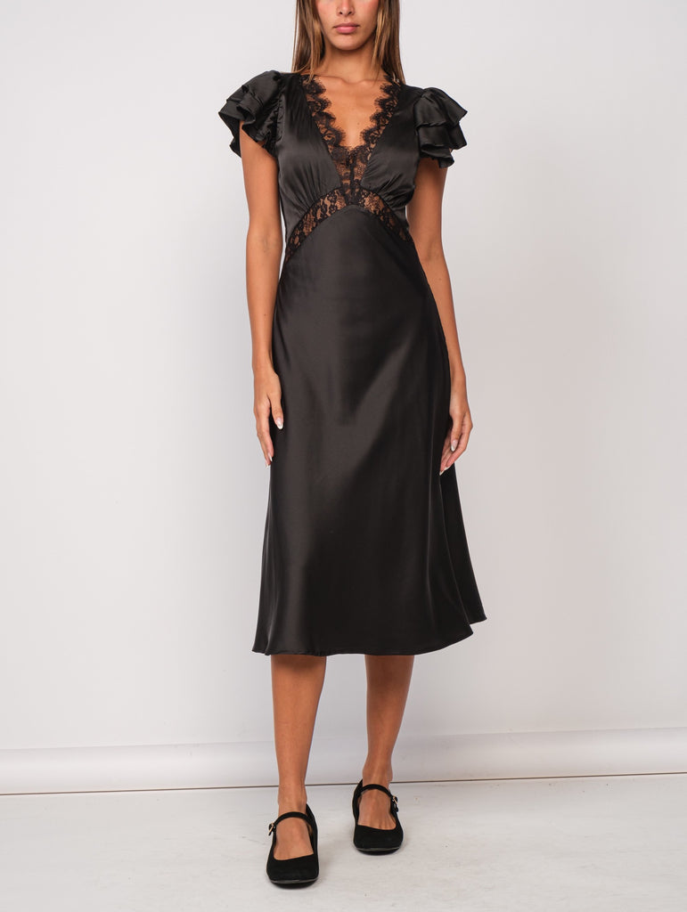 Piper Lace Trim Satin Dress Black. This black maxi dress features ruffled sleeves and lace trim for an elegant look perfect for a holiday party or special night out.