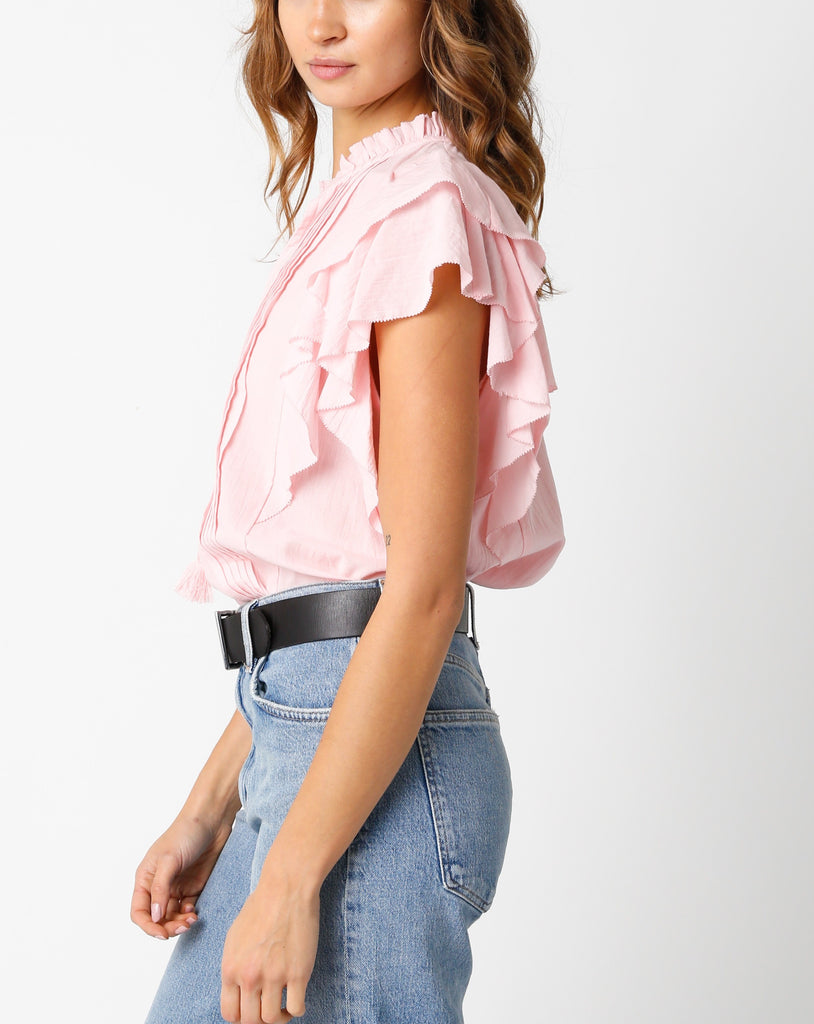 Jayla Ruffle Sleeve Blouse Light Pink. This ruffle sleeve blouse features a v-neckline with tassel bottom front ties, the perfect top to throw on with your favorite jeans for an easy put together look.