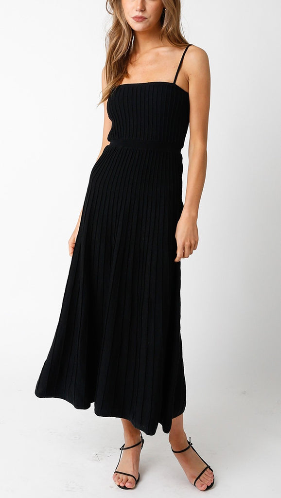 Leilani Rib Midi Dress Black. This sleeveless midi dress features a square neck and ribbed body, the perfect black dress for any occasion, so easy to dress up or down for a classic chic look.