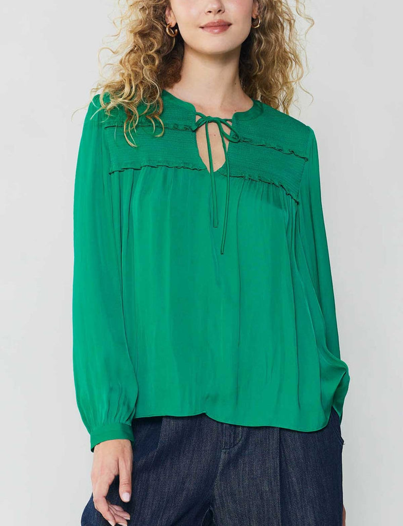 Current Air Smocked Yoke Tie Blouse Green. This long sleeve split neck top features a self-tie and ruffle detail, the vibrant green is a perfect pop of color to add to your wardrobe.