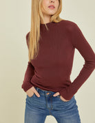 Moonbeam Long Sleeve Sweater Wine. This ribbed long sleeve sweater features a mock neckline and fitted design making it the perfect layering piece for everyday.