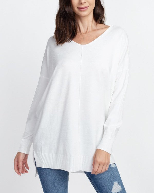 Nina Front Seam V-Neck Sweater Off White. This front seem sweater features a v-neckline and is a closet staple for year round wear, so soft and cozy you'll want to throw this on every morning.