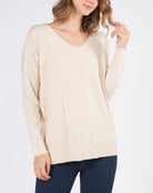 Nina Front Seam V-Neck Sweater Heather Oatmeal. This front seem sweater features a v-neckline and is a closet staple for year round wear, so soft and cozy you'll want to throw this on every morning.