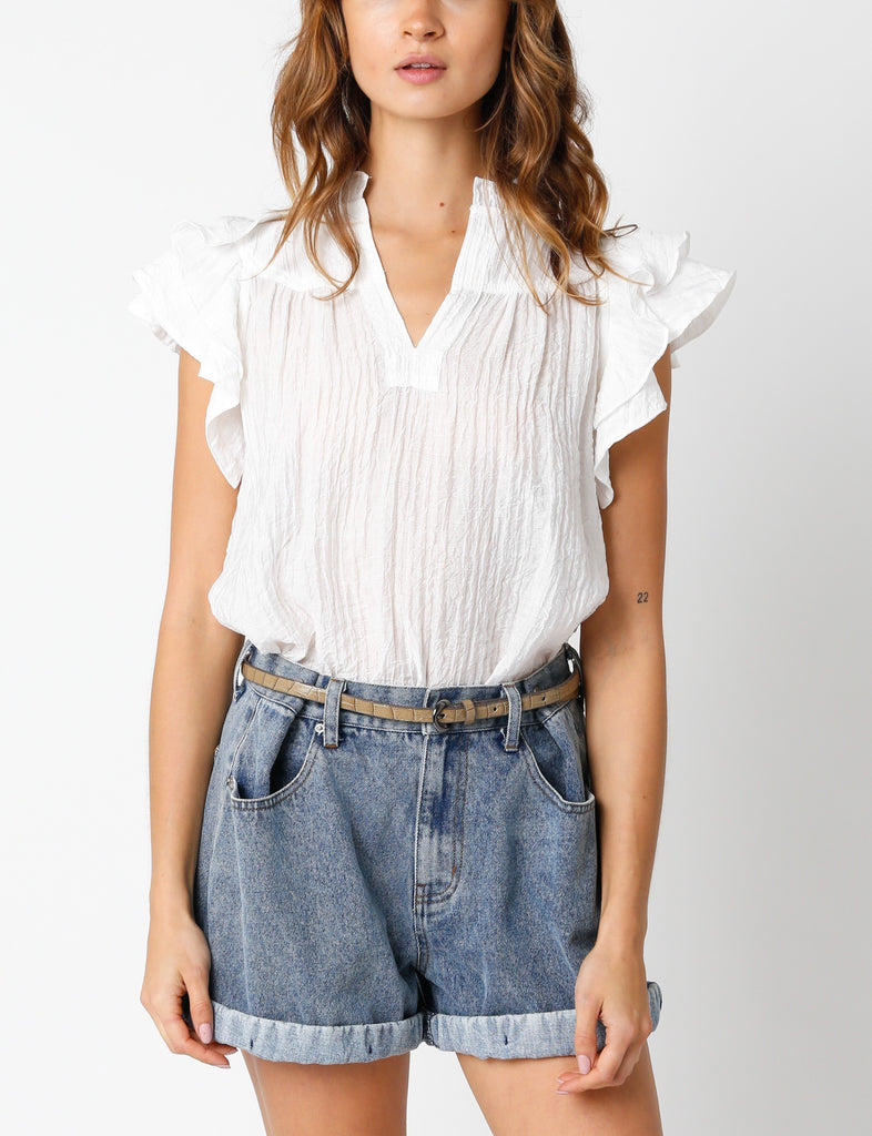 Cody Ruffle Sleeve Gauze Top White. This lightweight top features ruffle sleeves with a split v-neckline, the perfect top to wear with your favorite pair of blue jeans for a simple cute everyday look.